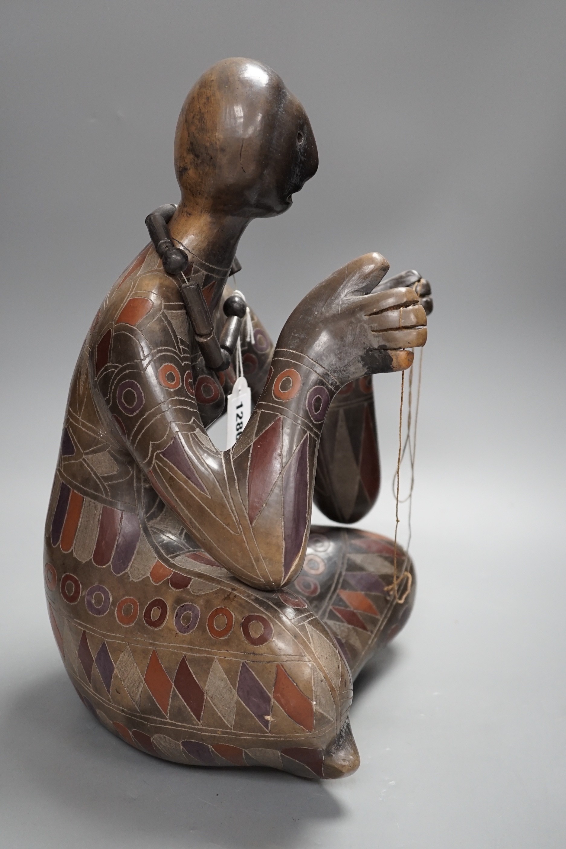 Manuel Felguerez Barra (Mexican/American 1929-2020) a terracotta abstract sculpture of a seated woman weaving. 39cm high